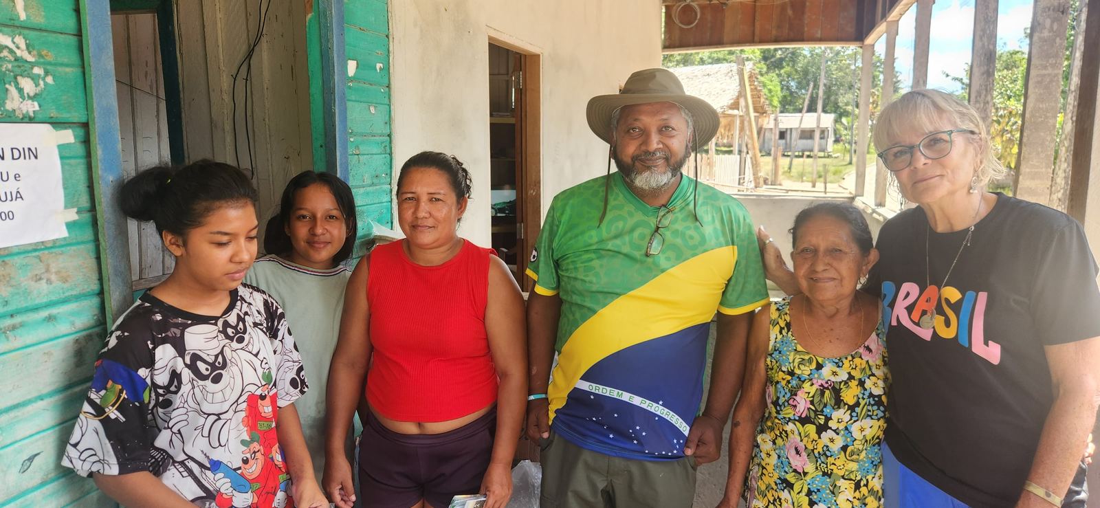 The Dominion team with a family in Brazil