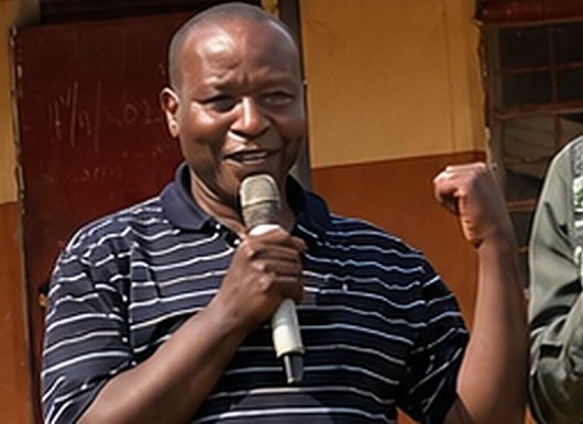 A leader with a microphone at a Deaf VBS in Uganda (photo: ICCD)