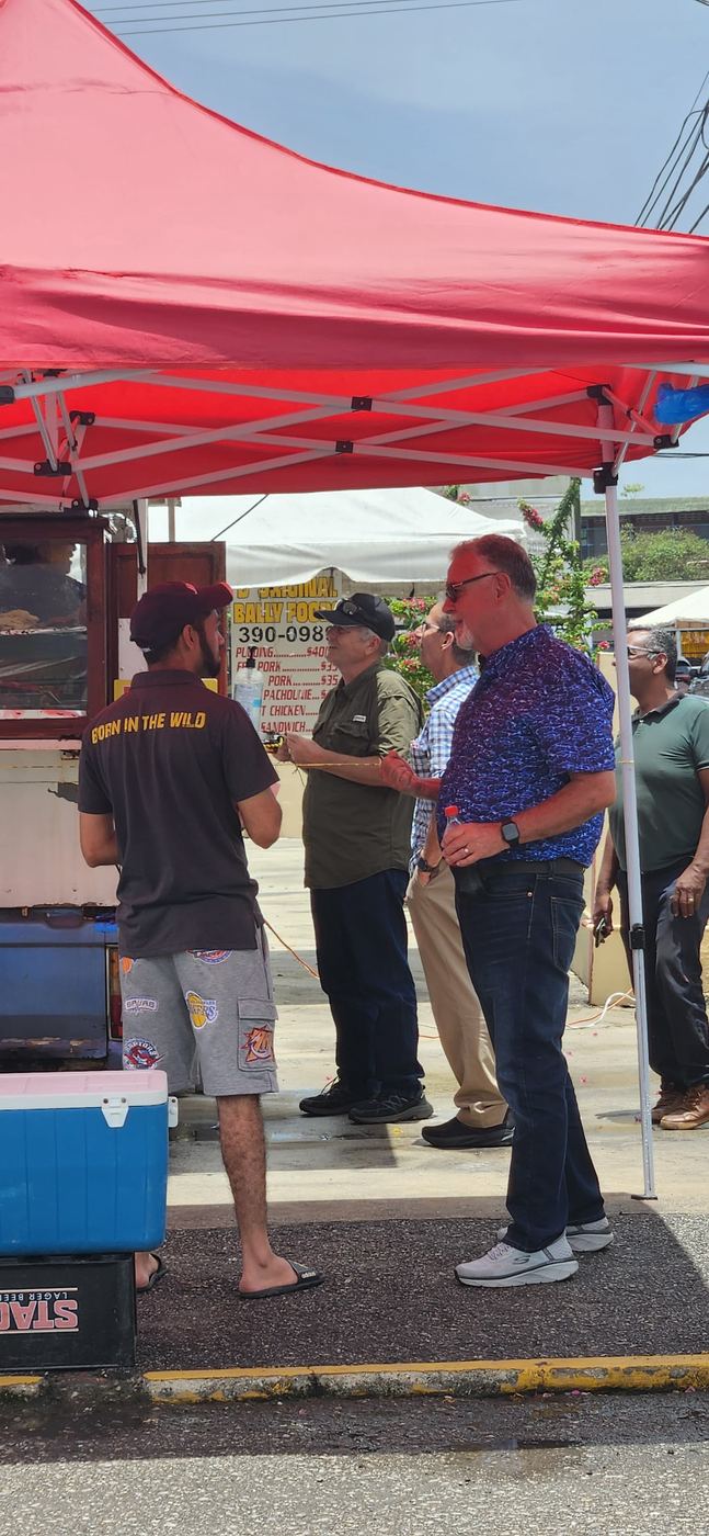 Street ministry under a red tent in Trinidad